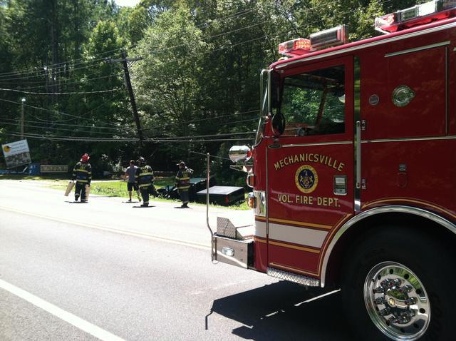 Firefighters on the scene of a motor vehicle accident on Golden Beach Road 